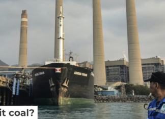 A fisherman looks at the Suralaya coal-fired power plant in Cilegon, Indonesia, in 2023. Ronald Siagian/AFP via Getty Images